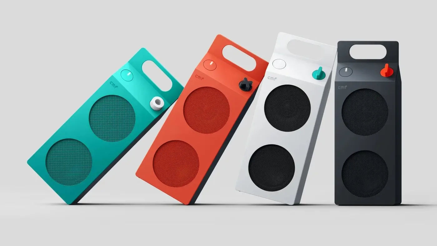 Four CMF Speaker M units in turquoise, orange, white and dark grey lined up at an angle