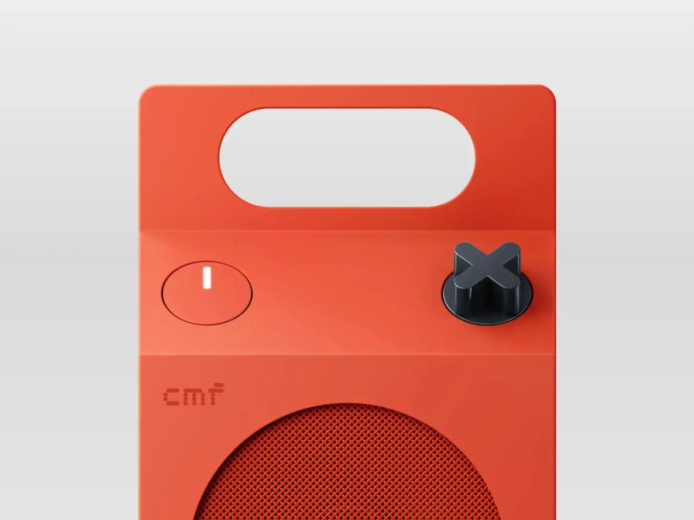 Top of an orange Speaker M with its volume knob and handle