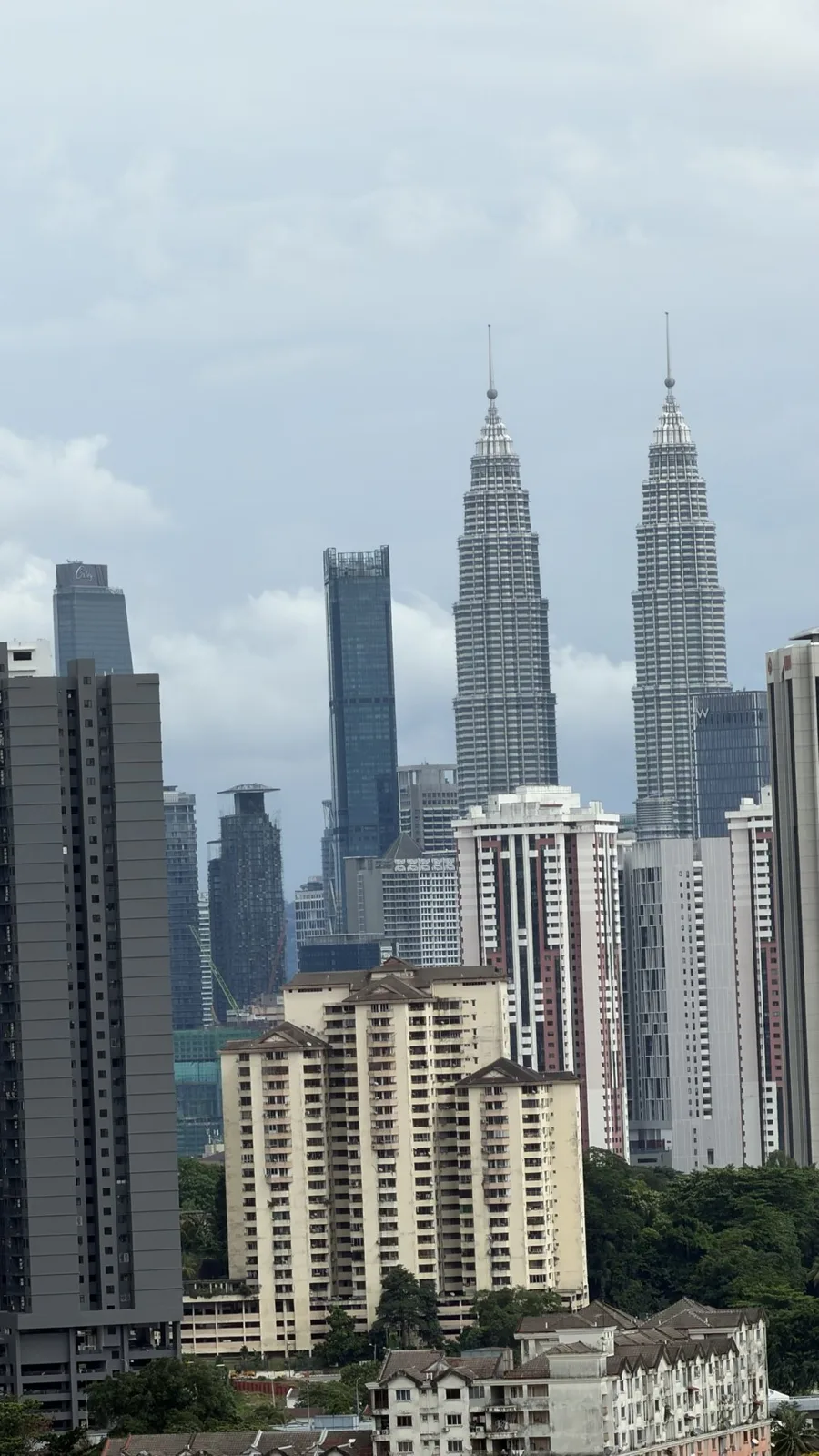 The Petronas Twin Towers clearly visible under a clear Kuala Lumpur sky on 25 October 2026, after the haze lifted